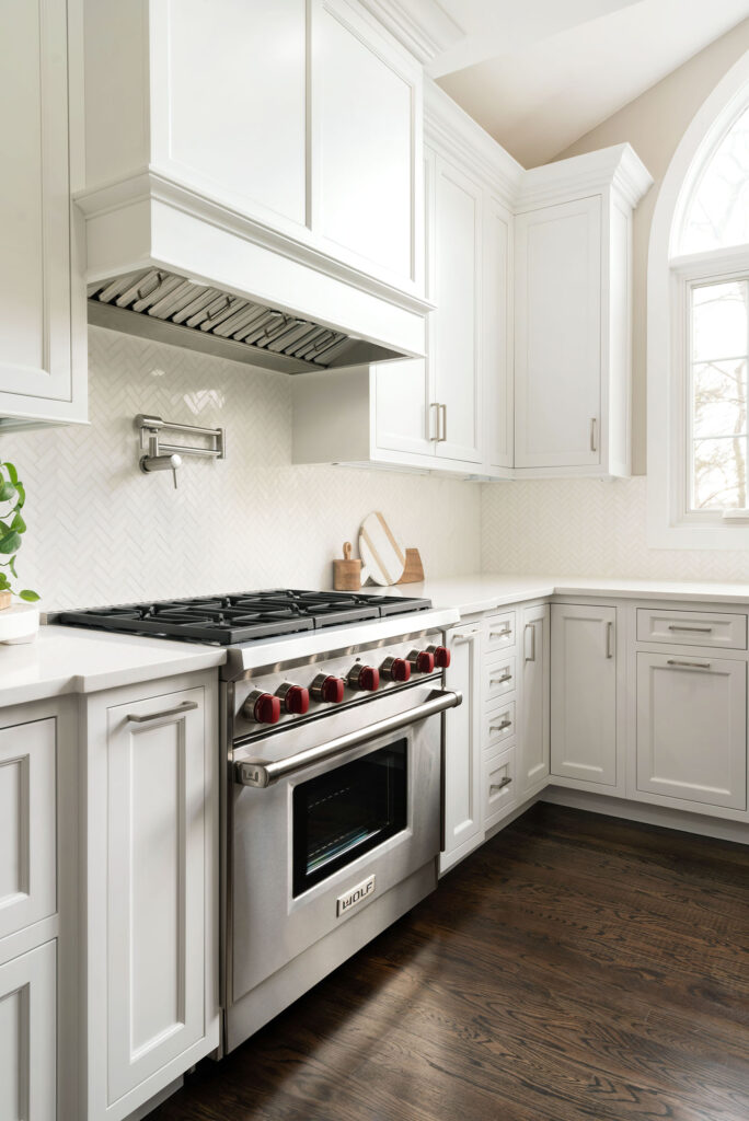 Wellsford Cabinetry Custom Kitchen Framed Plain Inset in Designer White Custom Wood Hood Wolf Oven